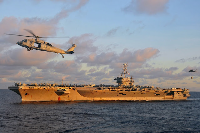 The Nimitz-class aircraft carrier USS George Washington conducts a vertical replenishment at sea in the U.S. 7th Fleet area of responsibility. 