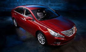 Front 3/4 view from above of red 2011 Hyundai Sonata