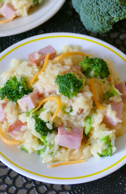 This ham cheesy broccoli rice dinner skillet is easy, delicious and one you'll want to add to your menu plan! Use any cheese you prefer and great for using leftover Easter or Christmas ham! Ready in less than 30 minutes which makes it perfect for a simple and affordable weeknight meal! 