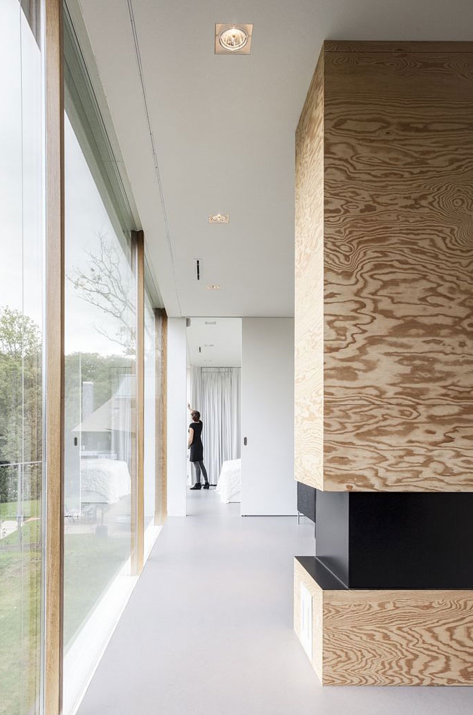 Interior and glass facade in Modern Villa V by Paul de Ruiter Architects