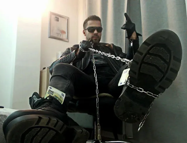 Full leather gear with chains Cocky Muscle Master Giving the Finger Curated by Oregonleatherboy