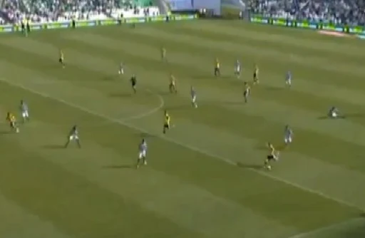Real Sociedad player Iñigo Martínez shoots from inside his own half to score against Real Betis