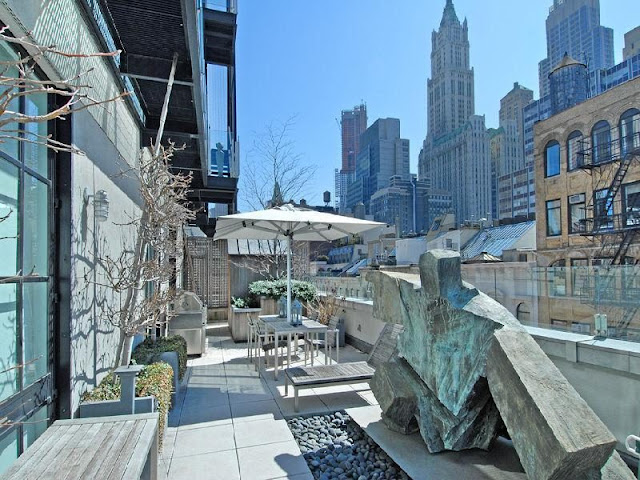 Photo of modern art sculpture and garden furniture on the rooftop terrace of Tribeca penthouse