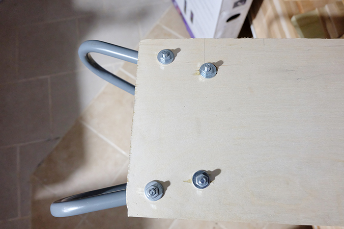 double u hanging bracket hook bolted to plywood