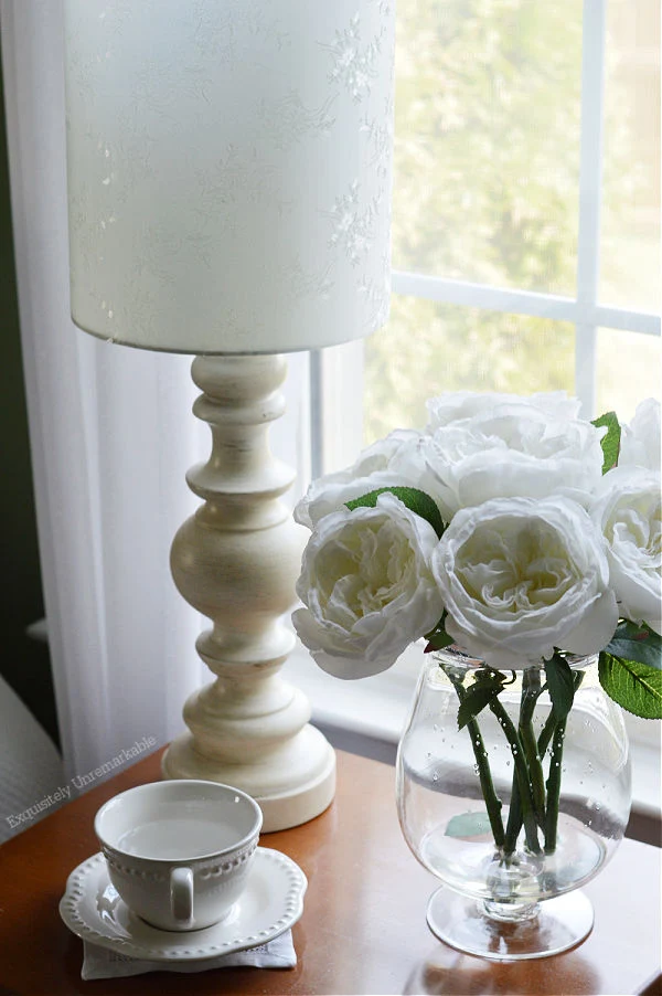 Cottage Style Bedroom Decor lamp and roses on nightstand
