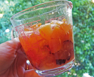 Measuring Cup with Cut-Up Fruit in it