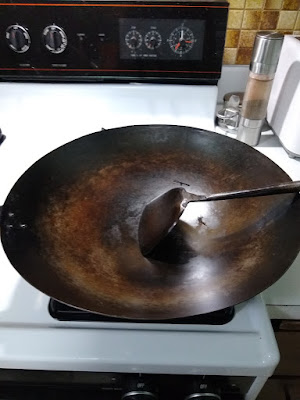 An old and well-seasoned wok