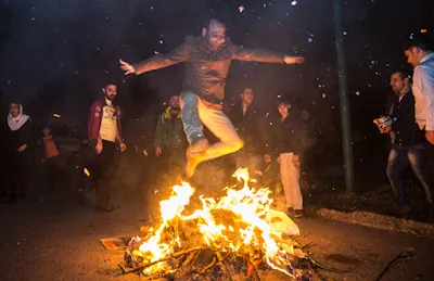 Iranian festival of fire and light is held the last Wednesday night before the Persian New Year. It includes people going to the streets and making bonfires and jumping over them while wishing felicity and healthiness in the New Year.