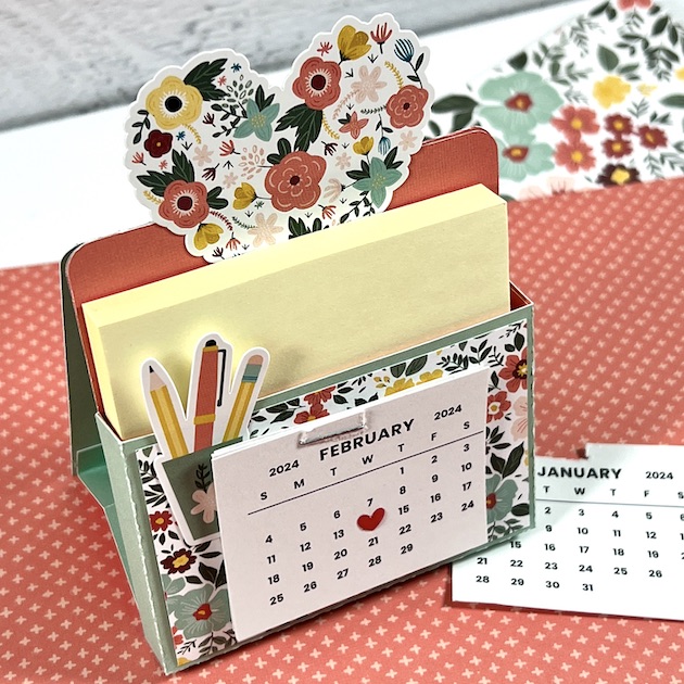 Sticky Note Calendar Box with a heart, flowers, note pad, and February Calendar