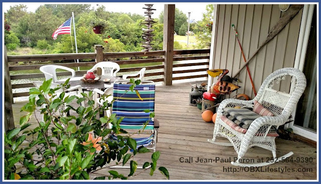 You will enjoy lounging in the huge covered deck of this stunning canal front home for sale in Corolla NC.