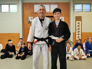 Professor Adam Evans with Theo Auckland Kids BJJ