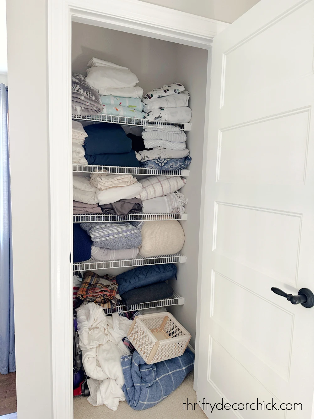 linen closet with wire shelving