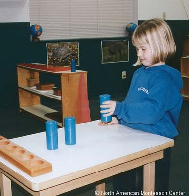 NAMC introduction to the montessori preschool classroom new montessori parents girl working with cylinders