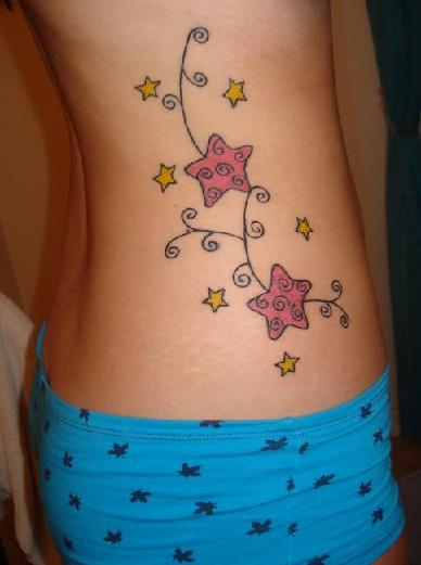Cute shooting star tattoo on female's back