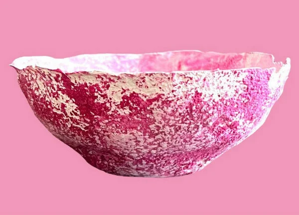 shallow pink and white roughly textured paper bowl