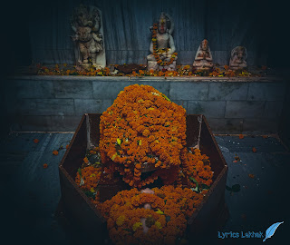 Shivling covered with Merigold flower