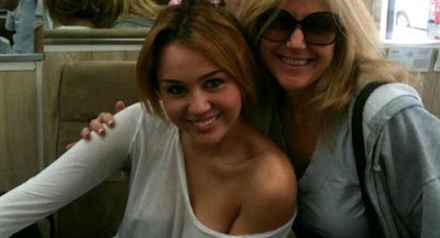 Miley Cyrus Shows Nipple Pokies in Braless Twitter Pic