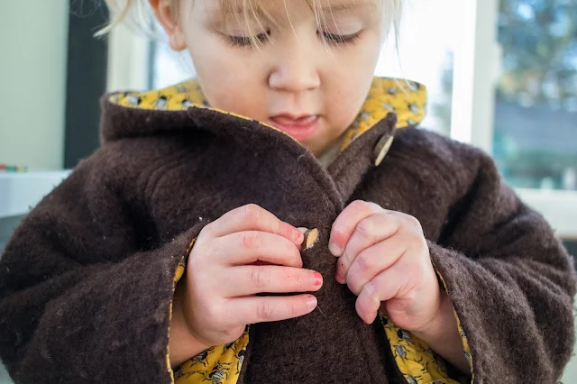 Montessori practical life - buttoning at 3-years-old