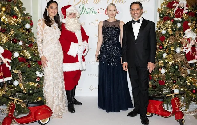 Princess Charlene wore a new sequined sleeveless tulle gown by Carolina Herrera. Christmas Ball 2022