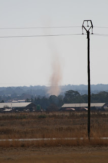 A twister that I'm sure started just upwind of the field, caused some havoc on the flight line and then developed into this