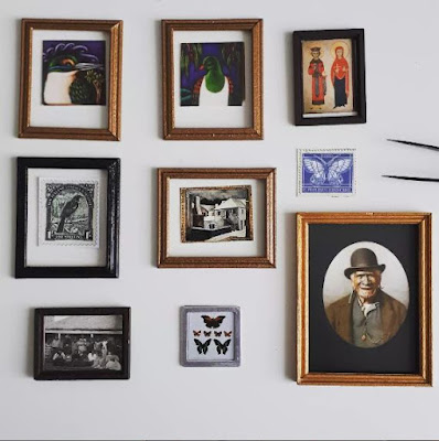Selection of one-twelfth scale miniature frames with pictures placed inside them