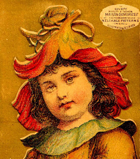 fanciful nasturtium of yellow & red serves as hat for girl