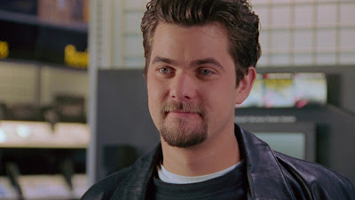 Pacey smiling as he watches Joey walk away