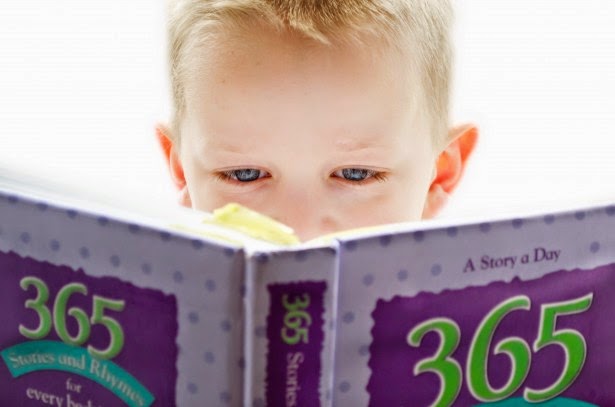 gender and literacy boy with big book