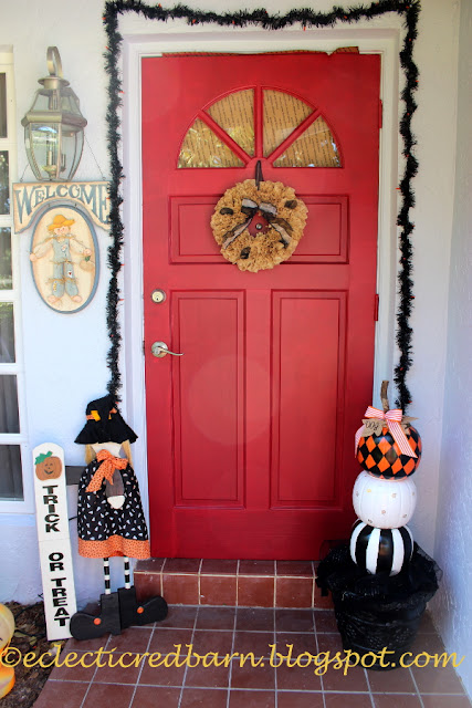 Eclectic Red Barn: Front door decorated for Halloween with stacked pumpkins