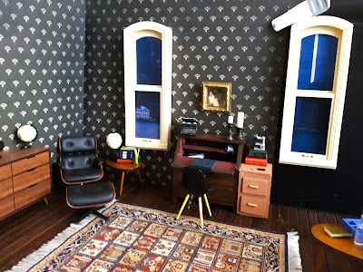 One-twelfth scale modern miniature study scene with long windows on each side of a writing desk.