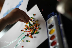 Instead of eating all that Halloween candy, kids can use it to make colorful fall trees.