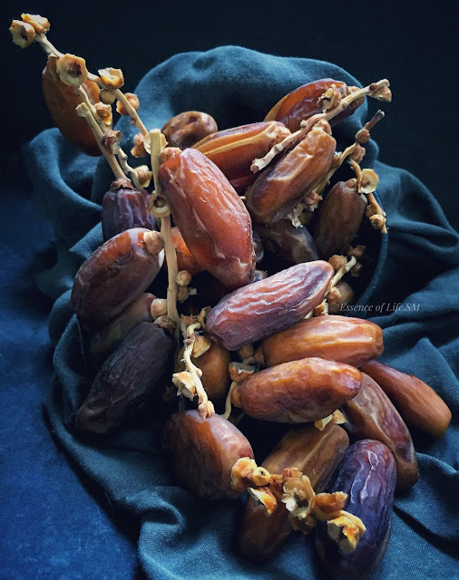 "Fresh dates in a bowl on aFresh Dates, symbolizing the breaking of fast during Ramadan."