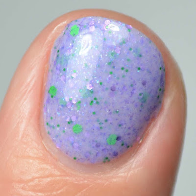 purple glitter nail polish close up swatch