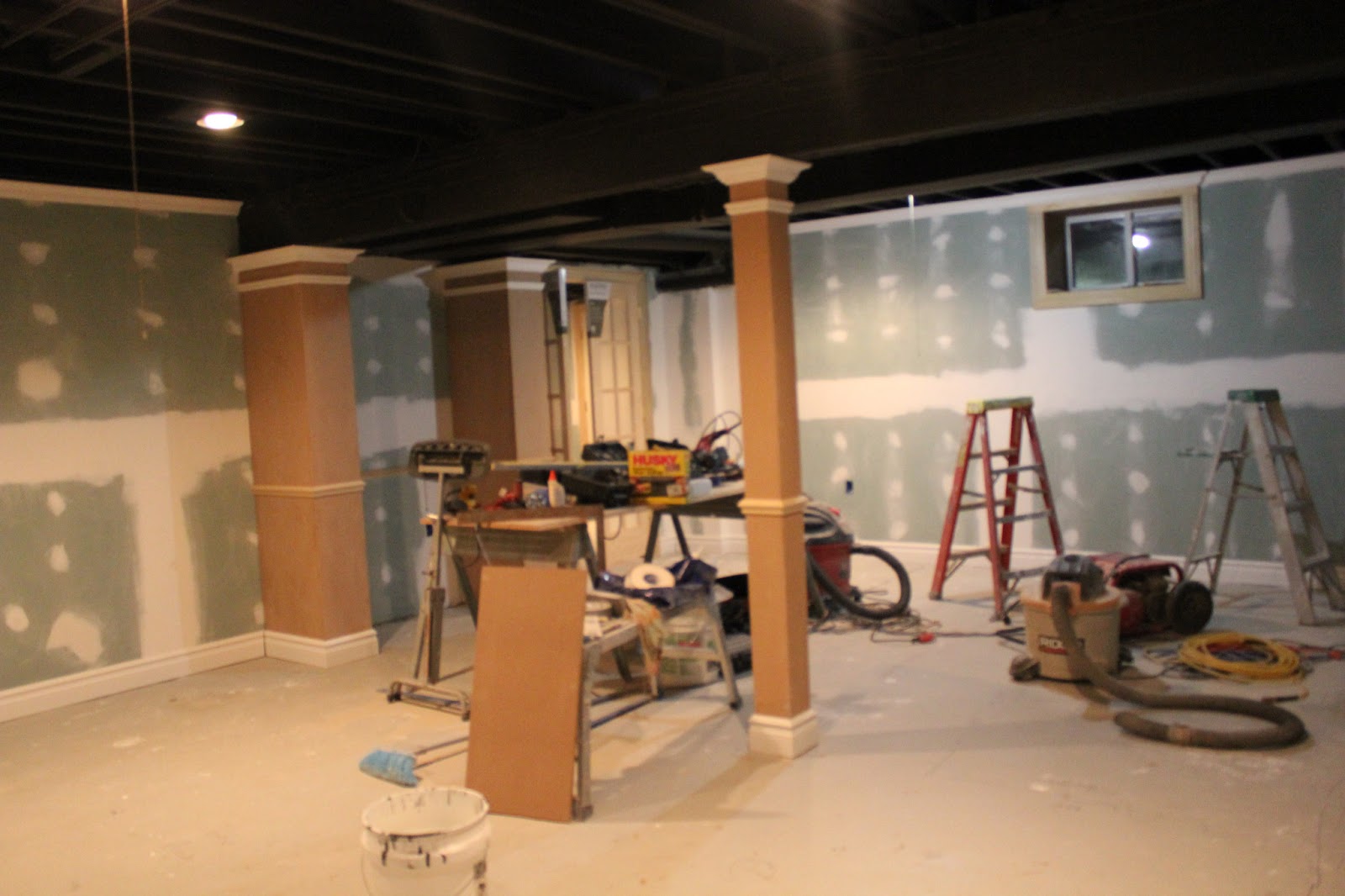 Basement Remodel With Painted Exposed Ceiling  