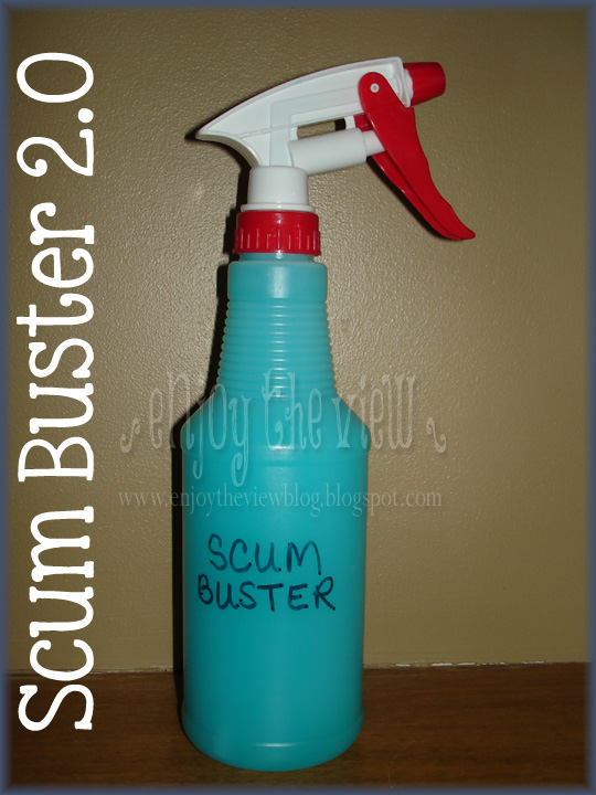 bottle with blue solution marked Scum Buster