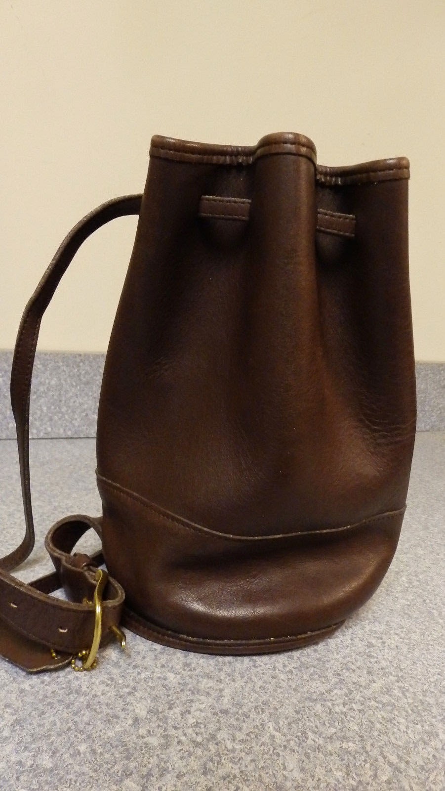 http://www.ebay.com/itm/Coach-purse-Brown-Sling-Backpack-Bucket-purse-No-F6D-9984-/321687351038?pt=LH_DefaultDomain_0&hash=item4ae60f6efe