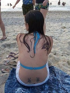 Sexy Girl With Design Dragonfly Tattoo on Lower Back Photo