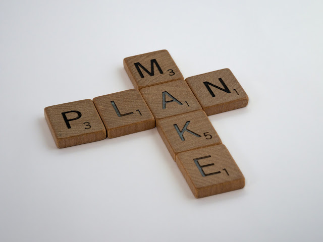 "make plan" spelled with tiles:Photo by Brett Jordan on Unsplash