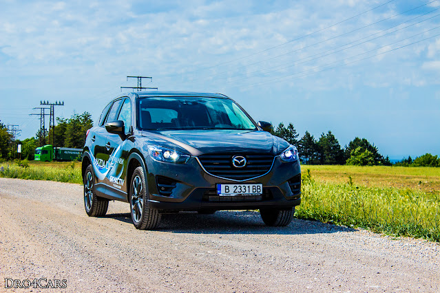 The 2015 Mazda CX-5 - side and front view 3/4 - medium shot.