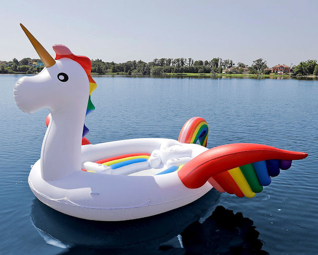 unicorn inflatable float in a lake