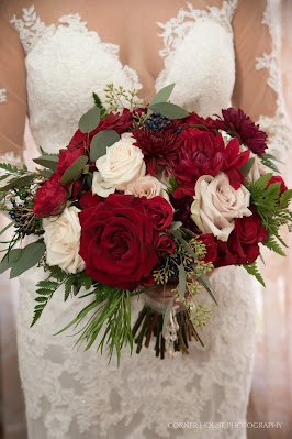bridal gown and maroon wedding bouquet