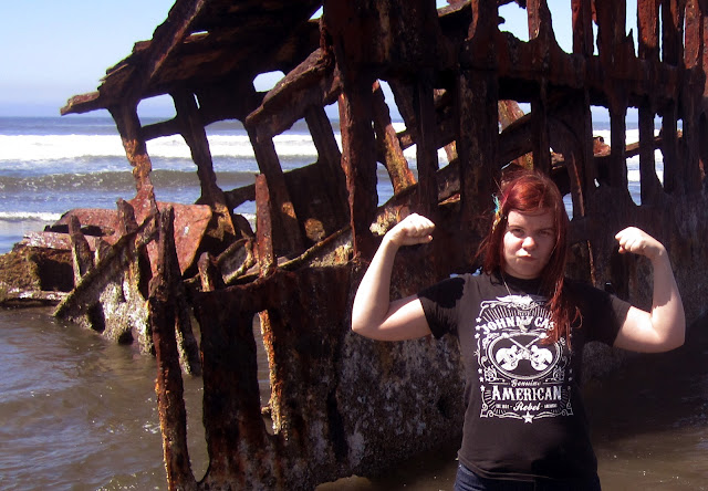 Amanda Zito in front of the Peter Iredale Shipwreck on the Oregon Coast in Fort Stevens State Park