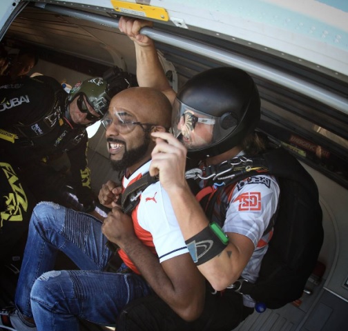 Singer, Banky W 'Dabs' in the Sky as He Jumps Off a Helicopter During Skydiving in Dubai (Photos)