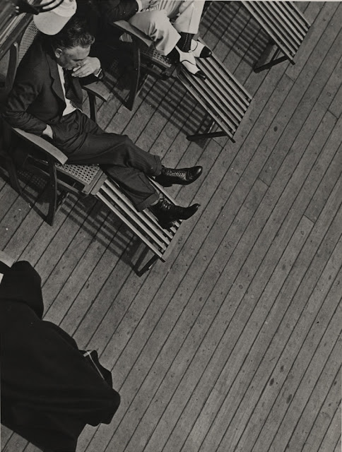 Relaxing passengers on Deck chairs