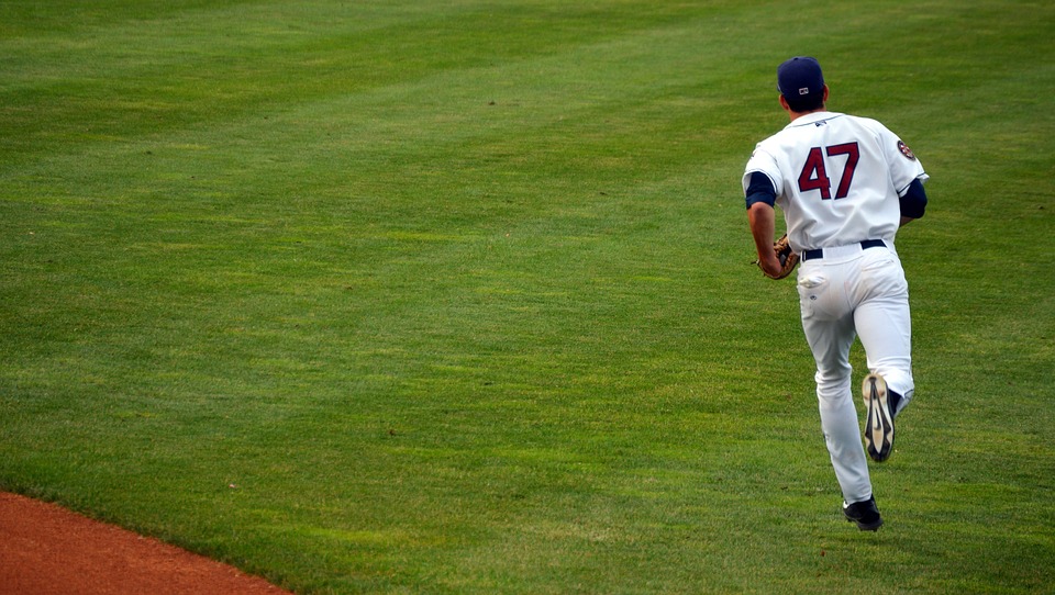 Baseball player running the game field