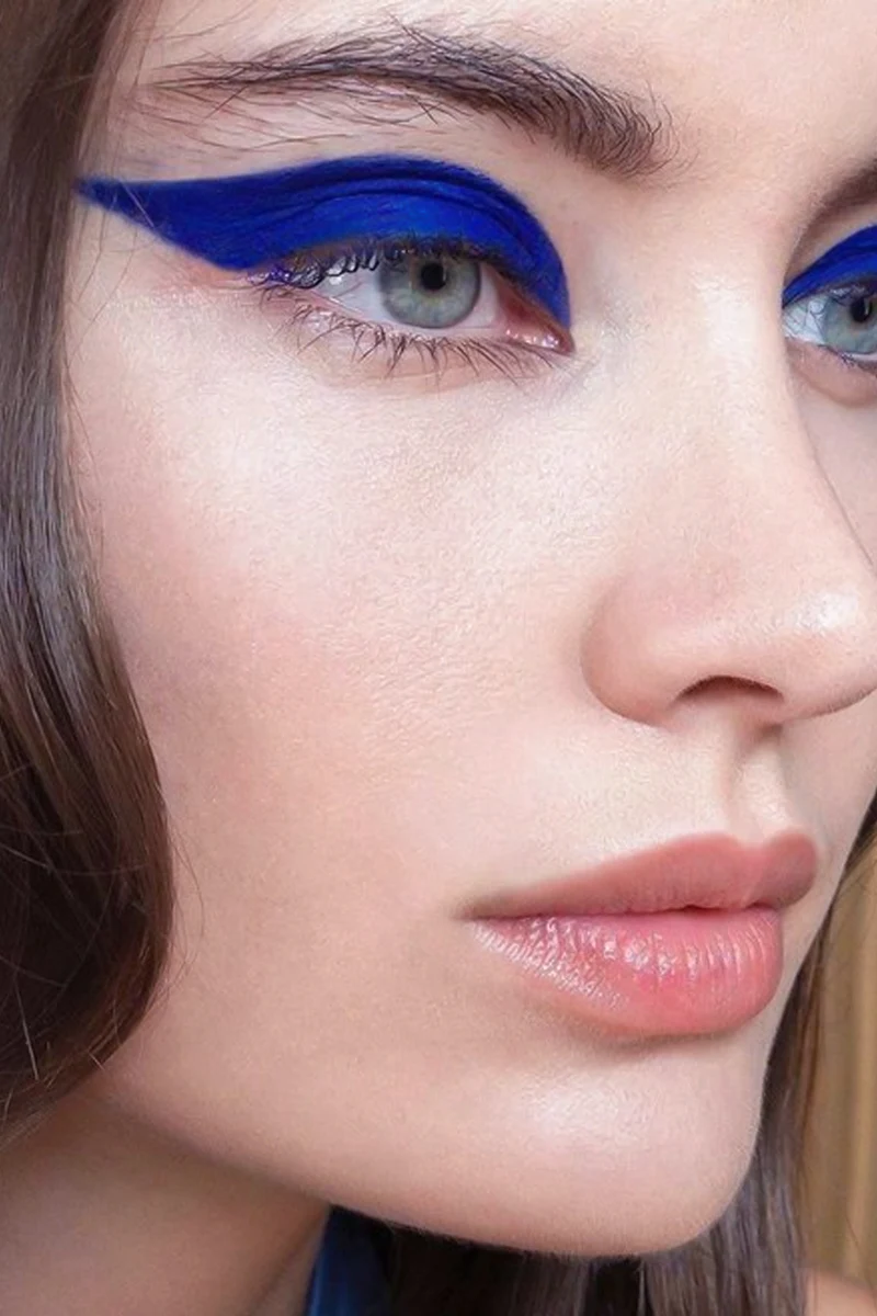 selfie of a beautiful woman with colorful graphic eyeliner look