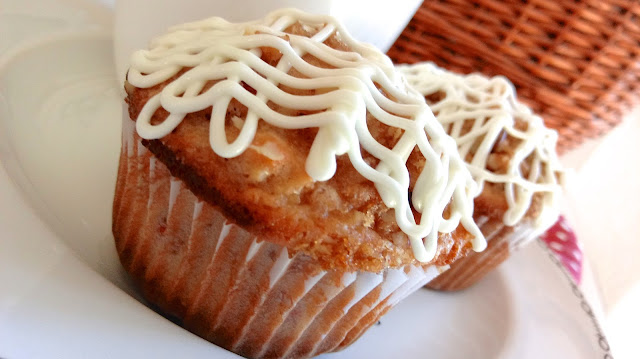 a close up of a Cranberry Bliss Muffin on a plate