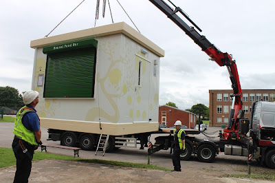 Food Cube being craned into position