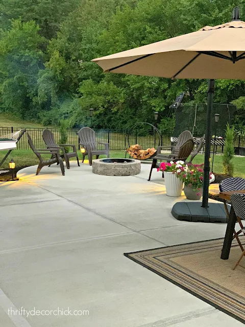 Large basic concrete patio with fire pit area