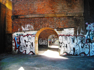 <img src="Arches near the A57 Inner Ring Rd, Salford.jpeg" alt="urban photography, old buildings, railway arches">